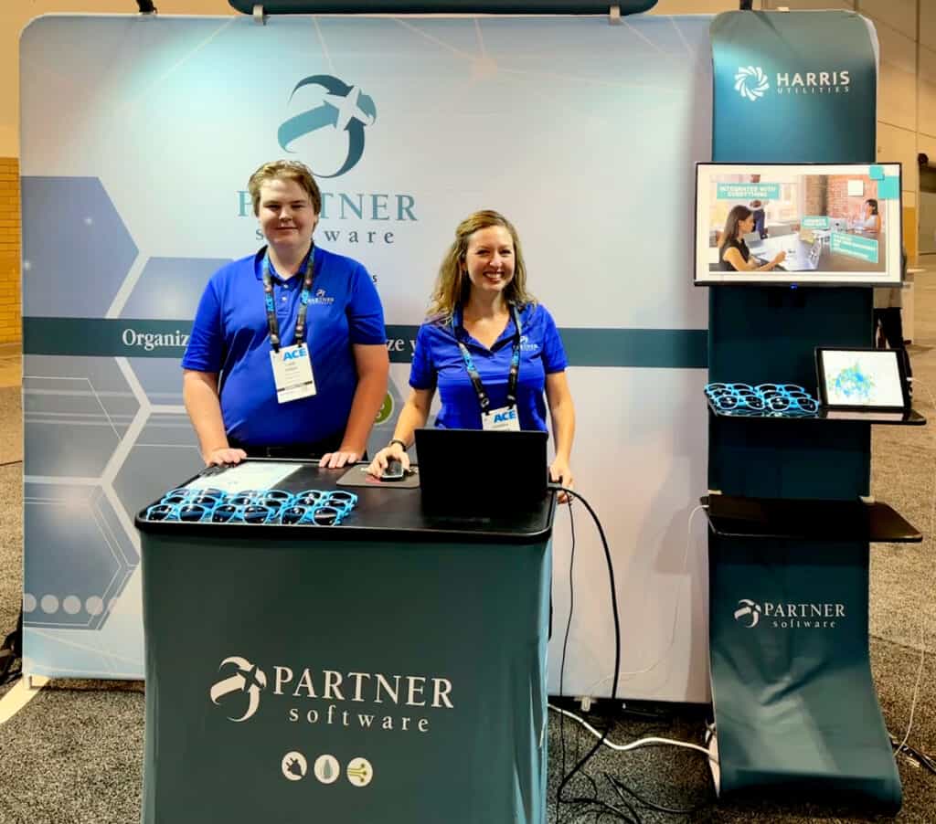 Partner Software employees working the new display booth